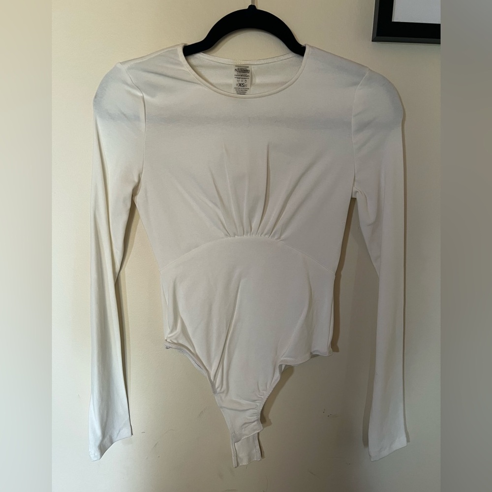 Kittenish white bodysuit